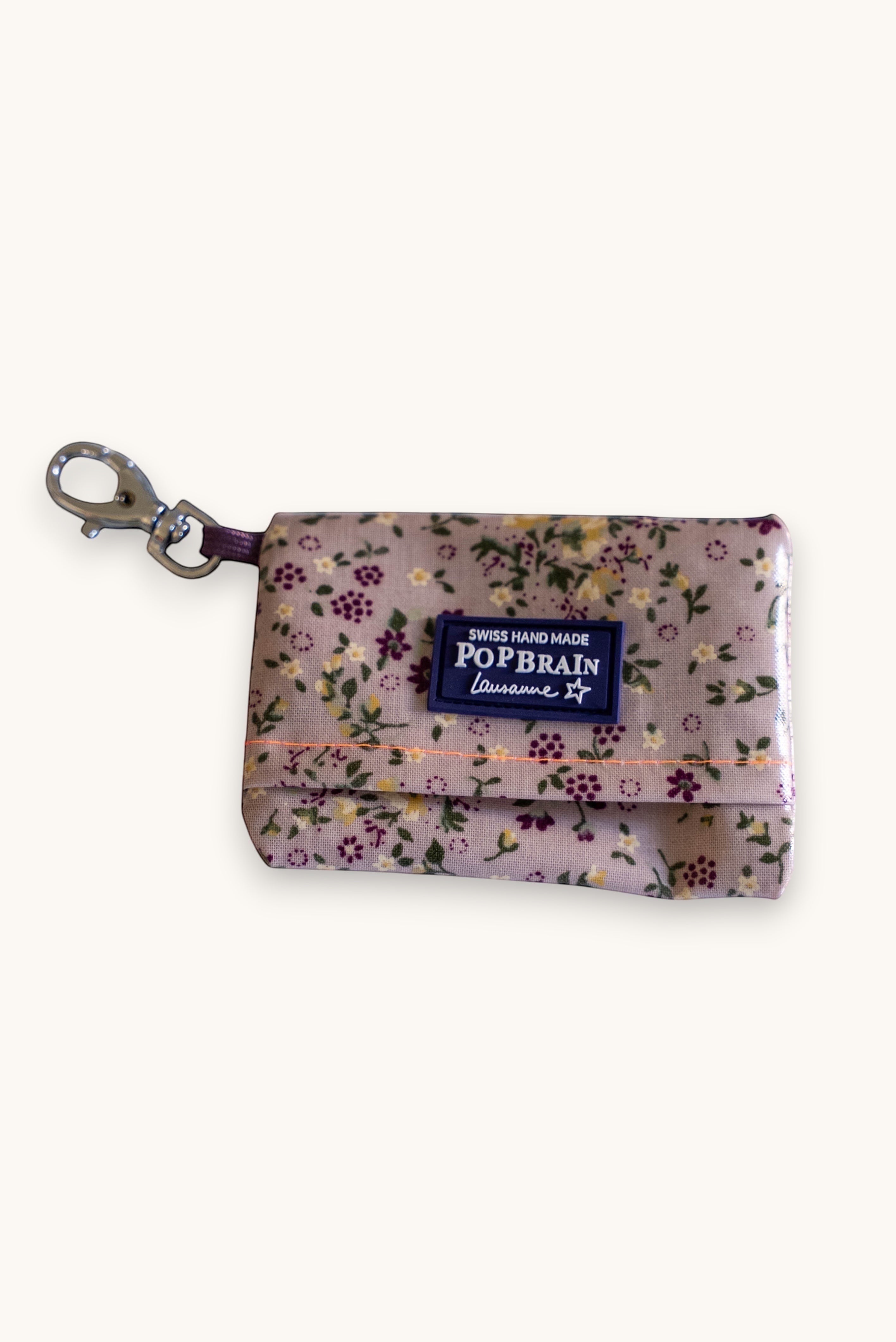 Popbrain waterproof floral PVC dog waste bag holder with metal clip, handmade in Switzerland.