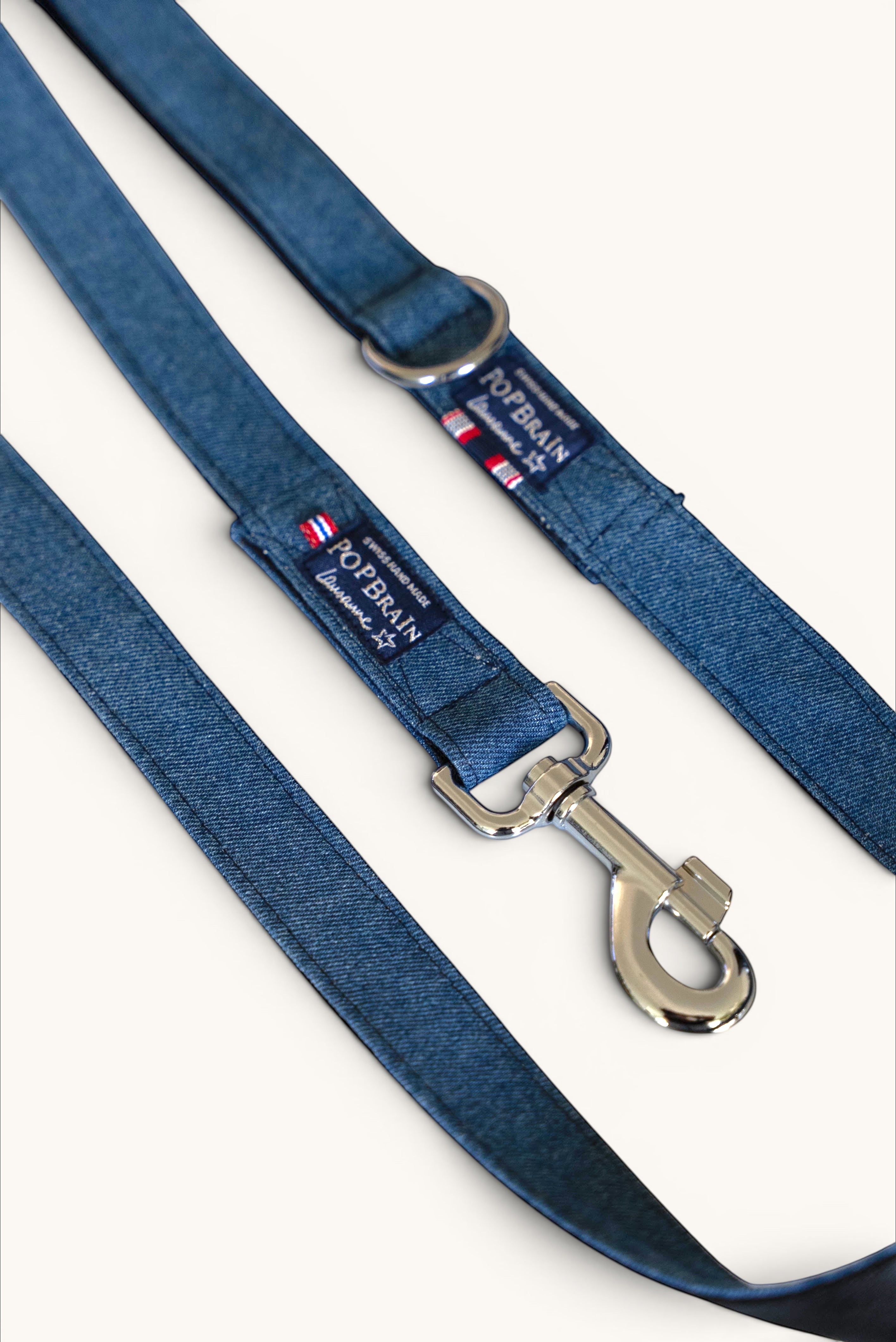 Popbrain indigo denim dog leash with silver hardware and Swiss handmade label, durable and stylish for daily walks.