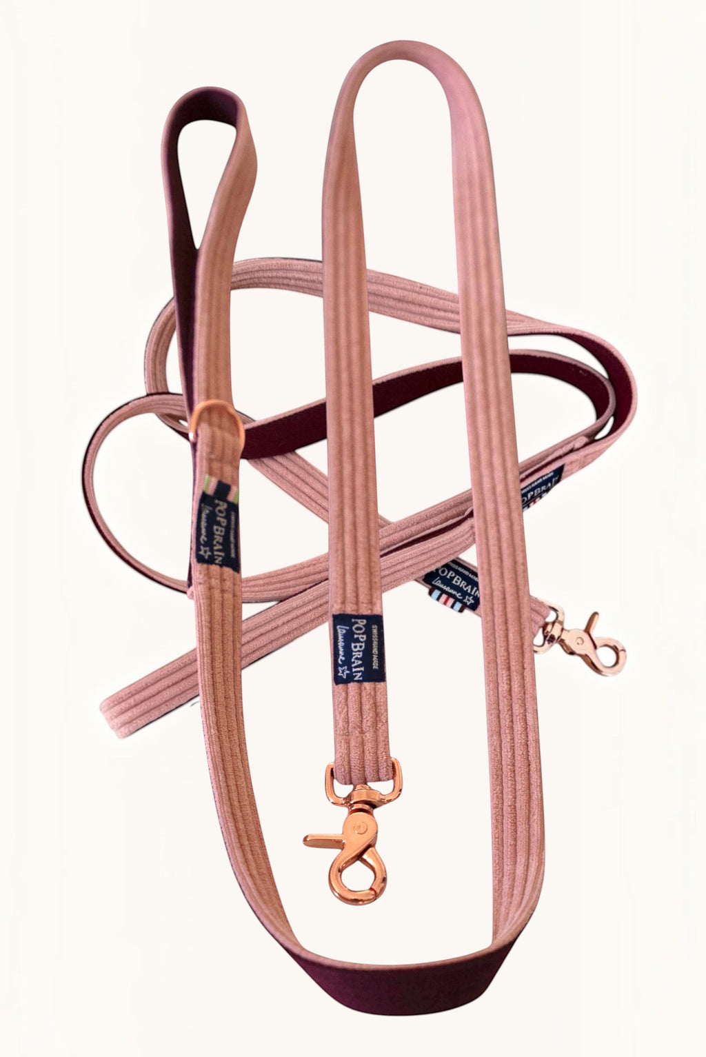 Popbrain powder pink corduroy dog leash with rose gold hardware and burgundy lining, handmade in Switzerland.