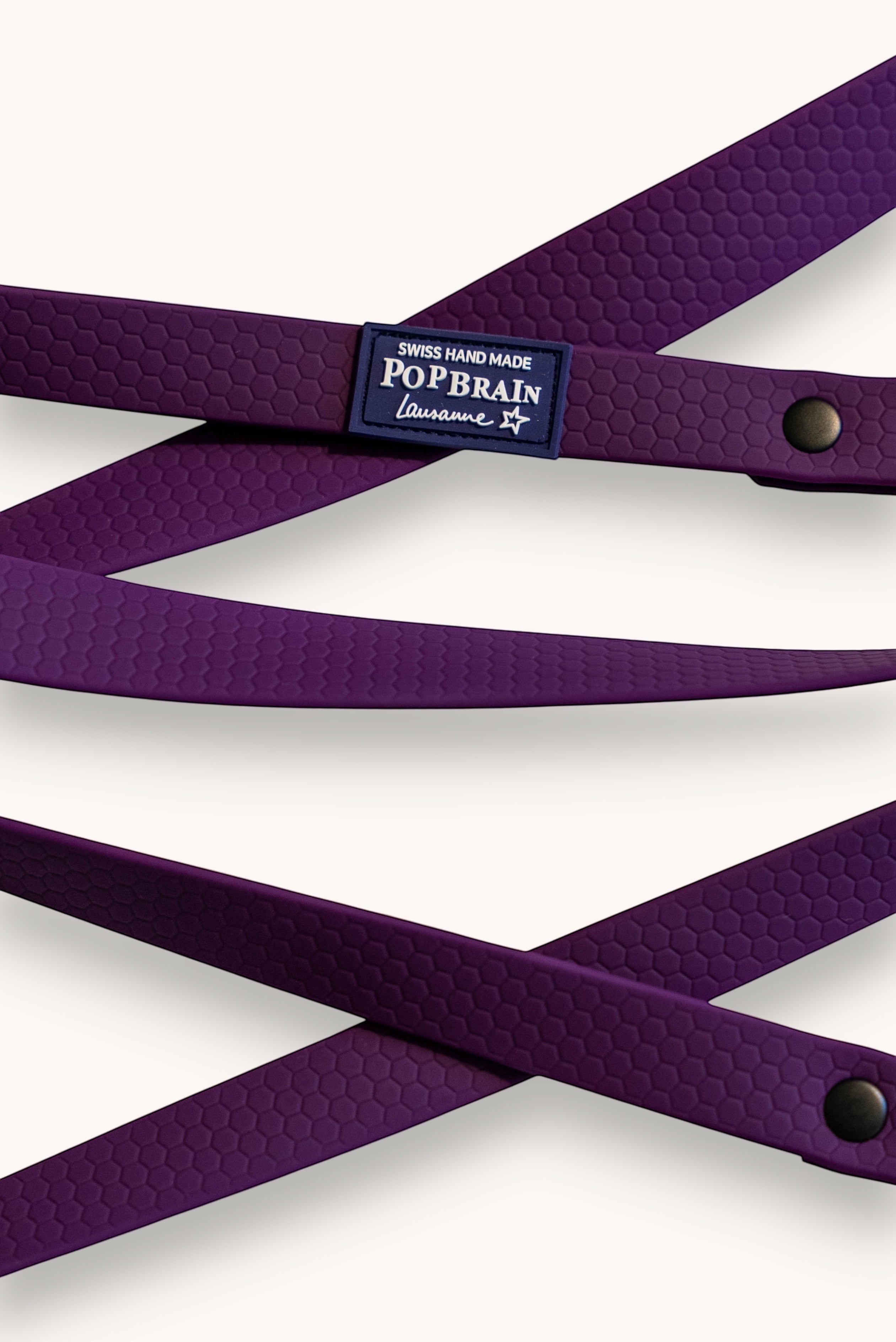 Popbrain purple waterproof PVC dog leash with honeycomb texture and matte black hardware, handmade in Switzerland.