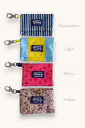 Popbrain waterproof PVC dog waste bag holders in four assorted patterns and colors with clips for leash attachment.