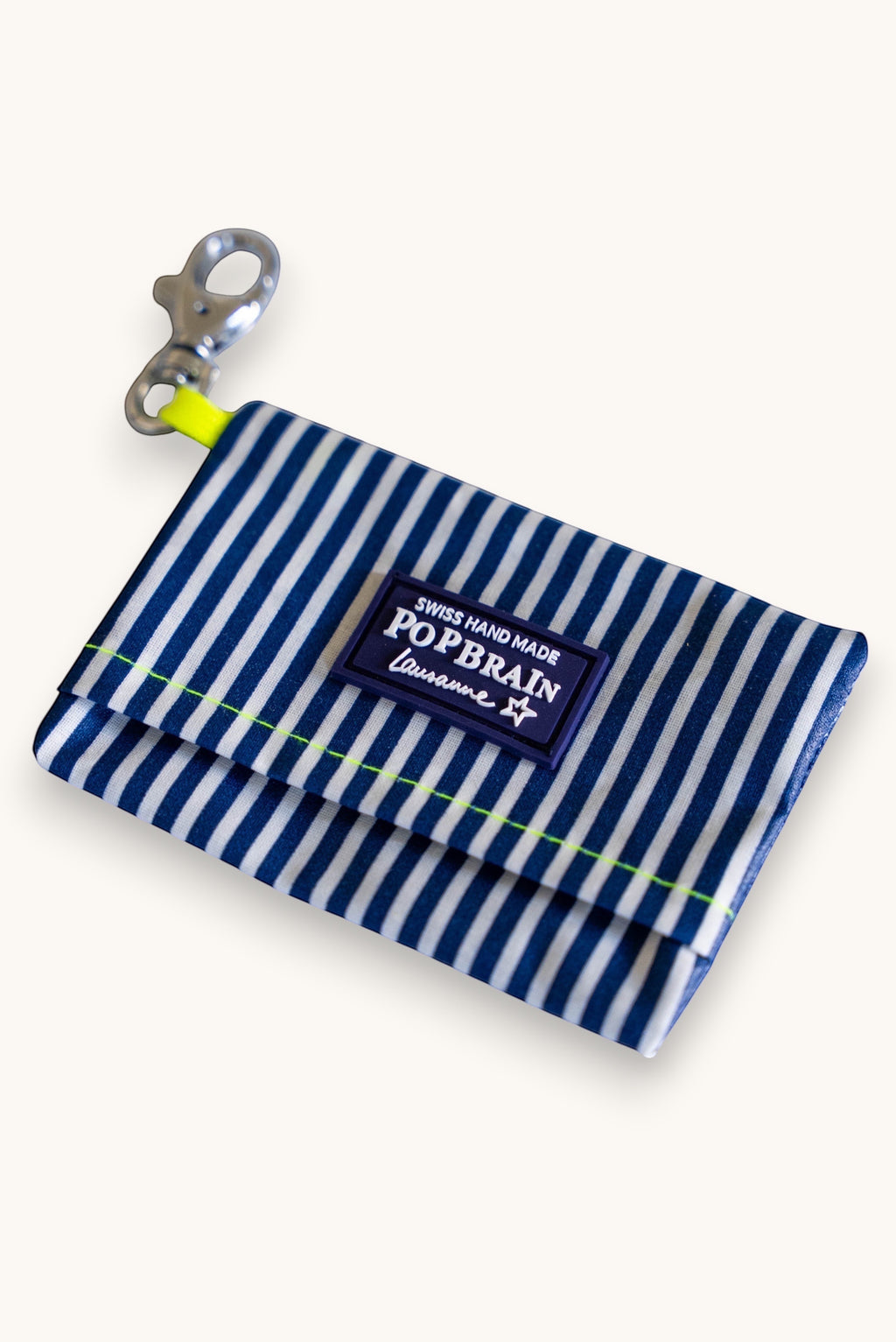 Popbrain waterproof navy and white striped PVC dog waste bag holder with neon yellow accents and metal clip.