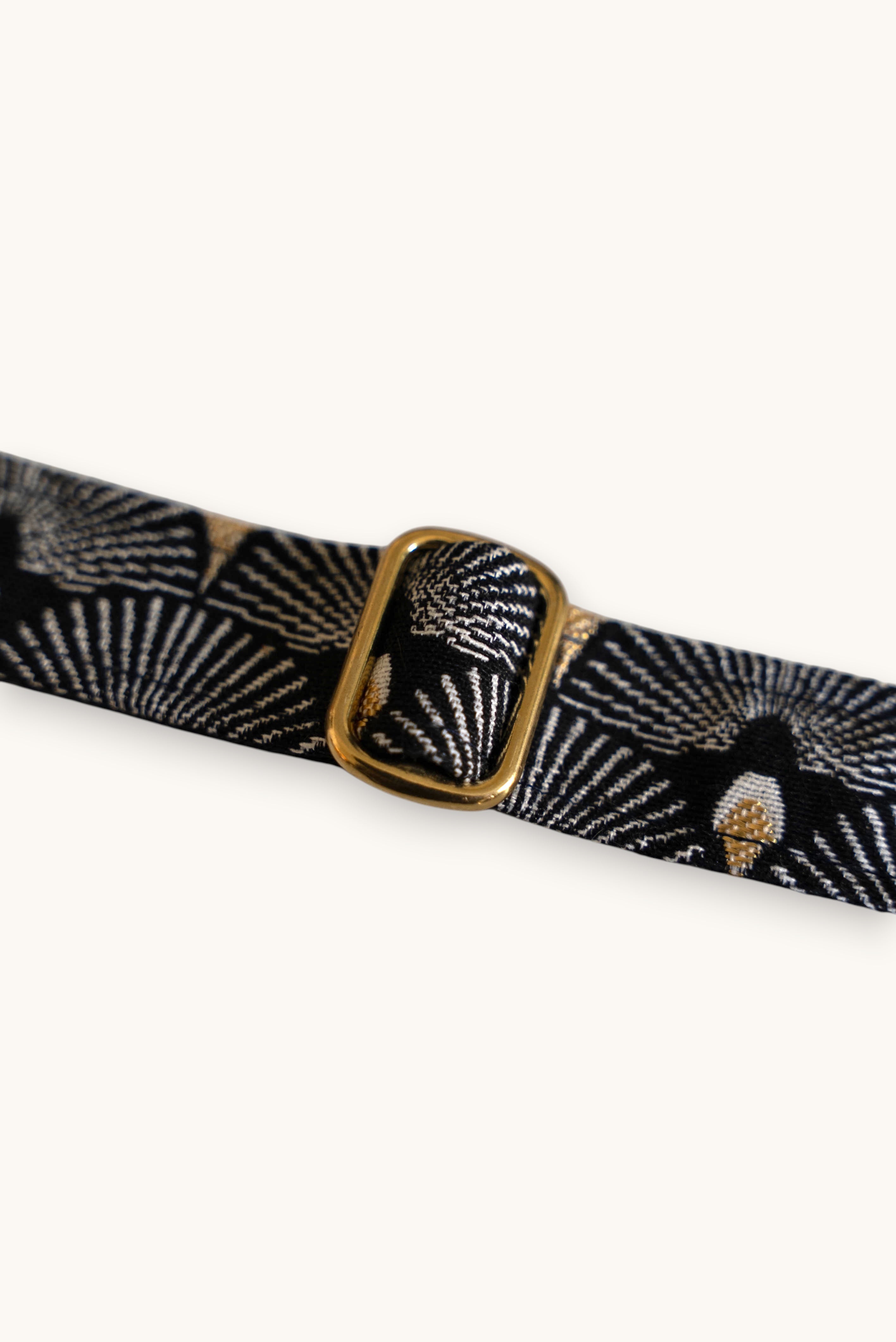 Popbrain Tokyo dog collar in black jacquard fabric with white and gold fan patterns and a gold brass buckle.