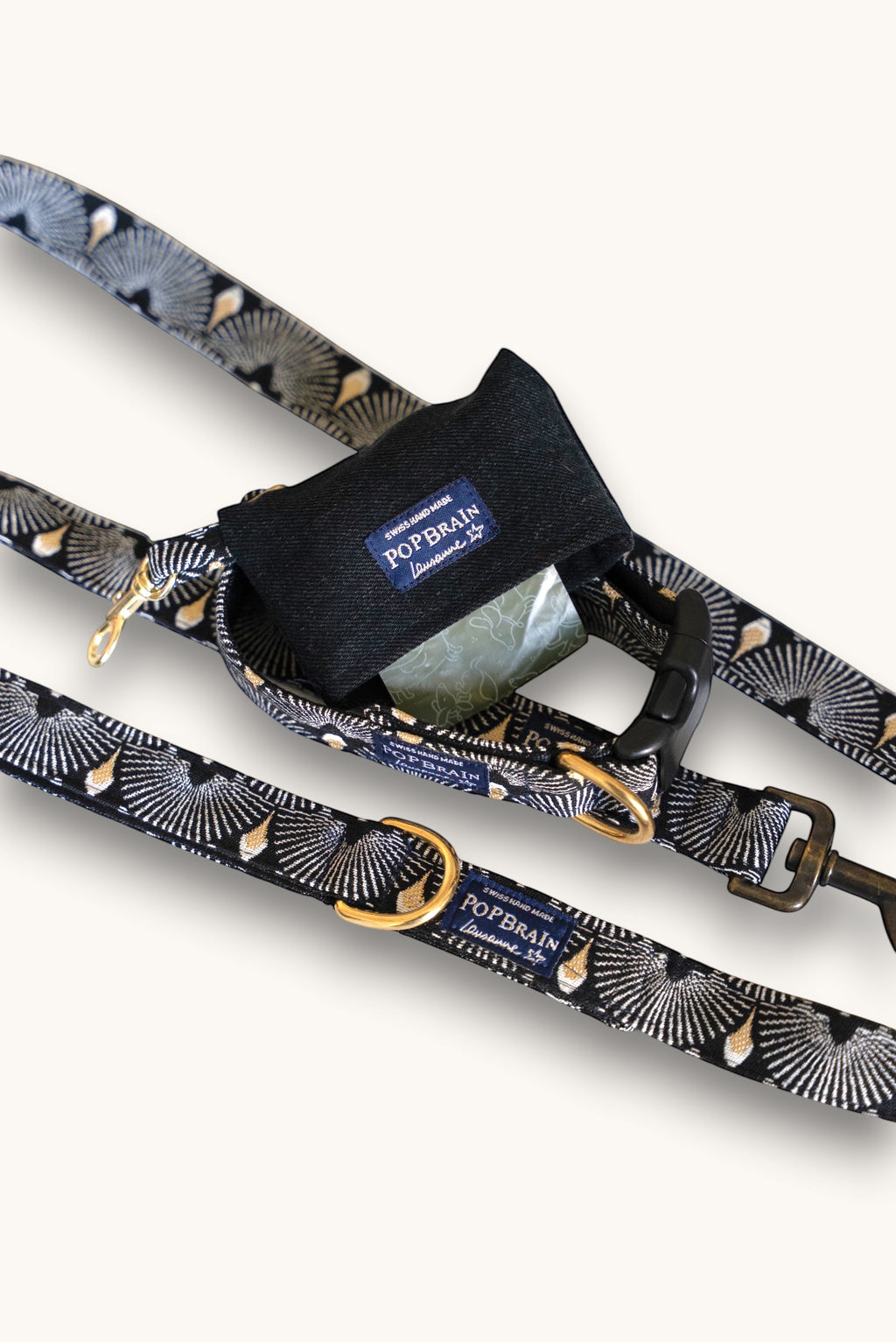 Popbrain Tokyo dog leash and matching waste bag holder in black jacquard fabric with white and gold fan patterns.