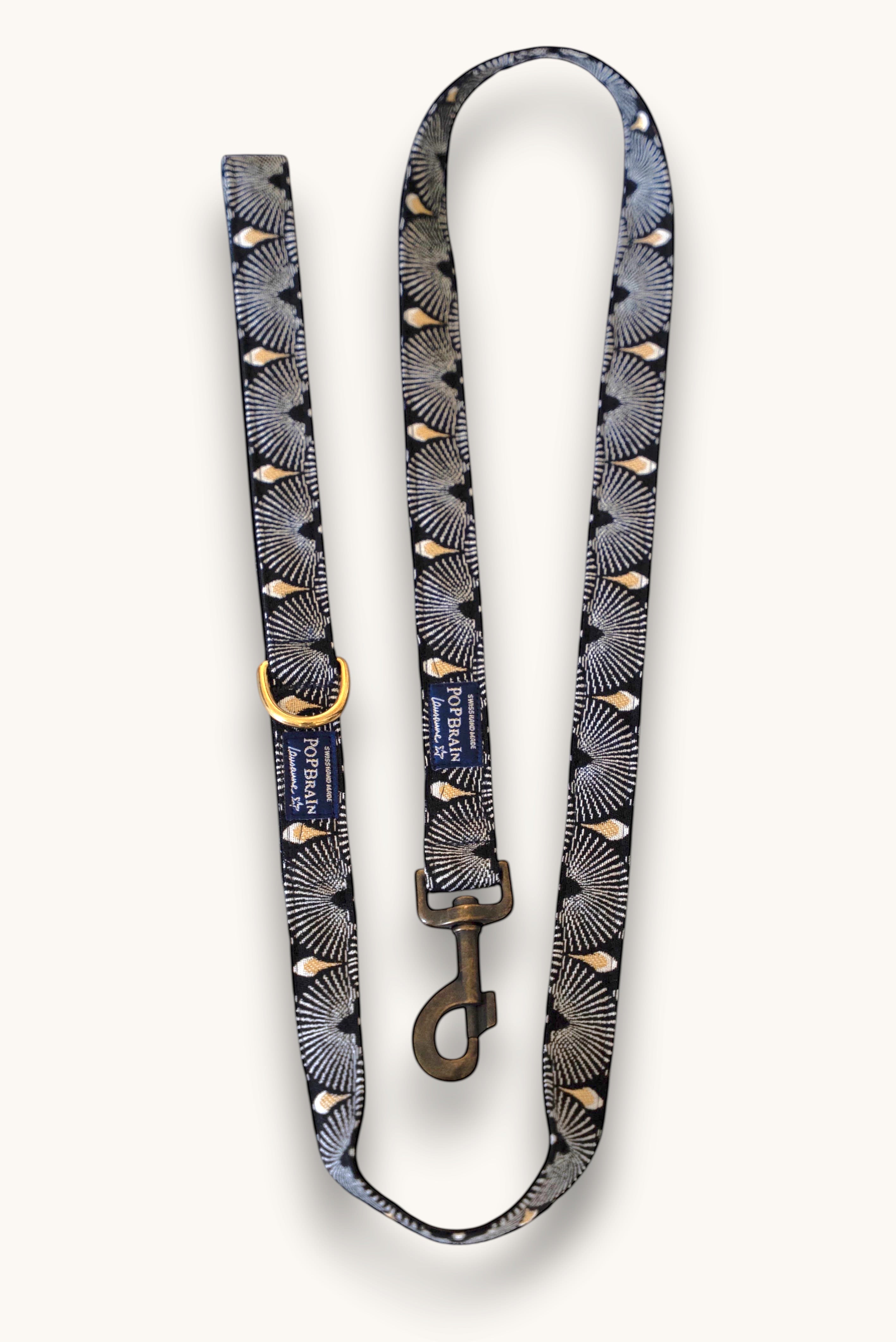 Popbrain Tokyo dog leash in black jacquard fabric with white and gold fan patterns and bronze hardware.